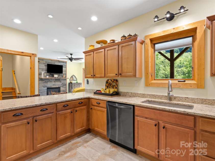 350 Inverness Drive, Waynesville, NC 28785.  MLS# CAR4207802, YatesRealty ID 8767. Maple cabinets and granite countertops
