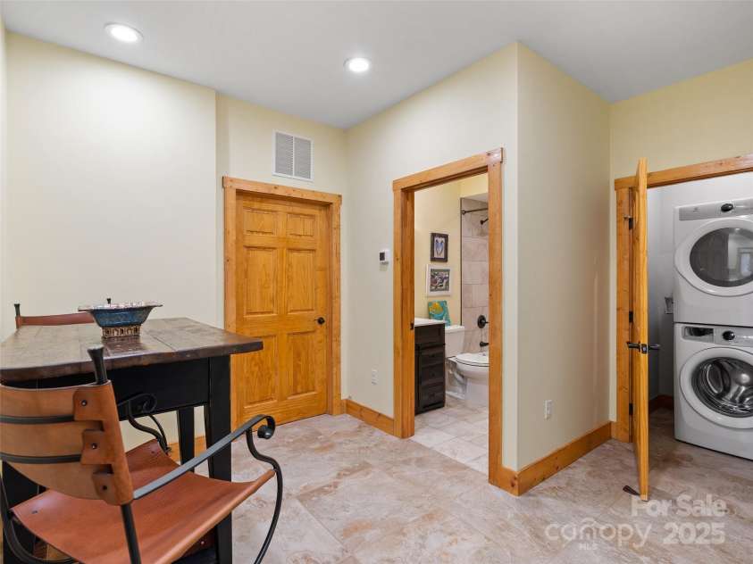 350 Inverness Drive, Waynesville, NC 28785.  MLS# CAR4207802, YatesRealty ID 8767. Terrace dining area and laundry closet