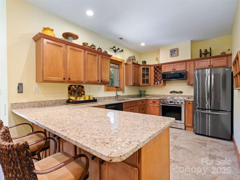 350 Inverness Drive, Waynesville, NC 28785.  MLS# CAR4207802, YatesRealty ID 8767. Terrace kitchen with breakfast bar
