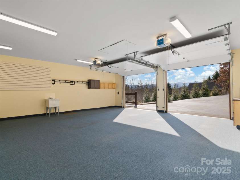 350 Inverness Drive, Waynesville, NC 28785.  MLS# CAR4207802, YatesRealty ID 8767. Two-car garage with walk-in closet storage