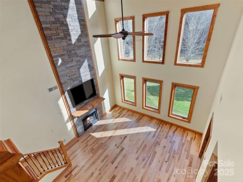 350 Inverness Drive, Waynesville, NC 28785.  MLS# CAR4207802, YatesRealty ID 8767. View of living room from loft