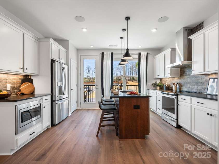 5516 Swaling Street, Charlotte, NC 28217.  MLS# CAR4318946, YatesRealty ID 8768. Chef's Kitchen Layout with GE Stainless Appliance Package. *Model Photos | Actual Finishes, Structural Selections, and Orientation May Vary.