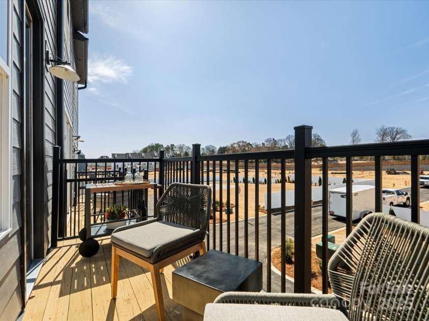 5516 Swaling Street, Charlotte, NC 28217.  MLS# CAR4318946, YatesRealty ID 8768. Outdoor Living With Modern Black Railing. *Model Photos | Actual Finishes, Structural Selections, and Orientation May Vary.