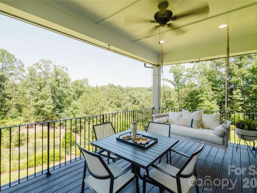 15431 Cimarron Hills Lane, Charlotte, NC 28278.  MLS# CAR4298385, YatesRealty ID 8774. Covered porch from the kitchen dining area
