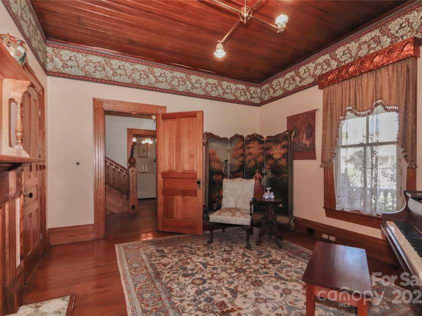 235 Walnut Street, Statesville, NC 28677.  MLS# CAR4134450, YatesRealty ID 8778. Front Parlor