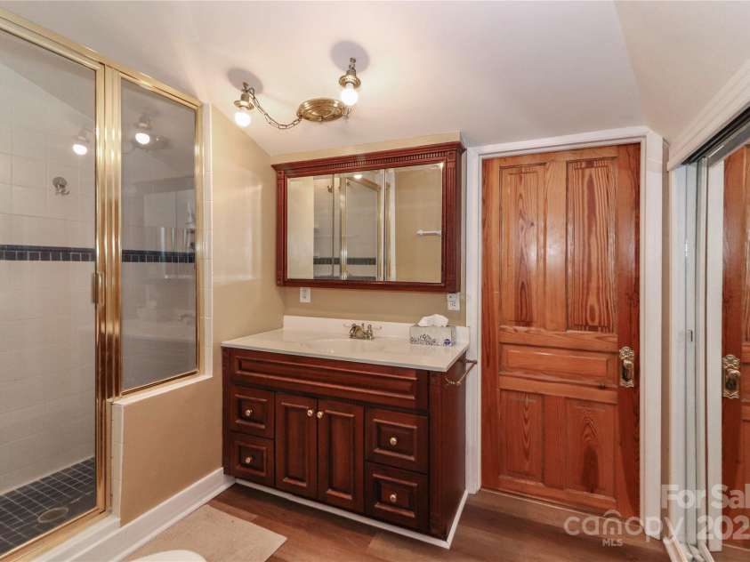235 Walnut Street, Statesville, NC 28677.  MLS# CAR4134450, YatesRealty ID 8778. Primary Bath with adjacent laundry room and walk-in attic space/storage