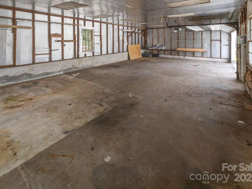 65 Oakley Road, Asheville, NC 28803.  MLS# CAR4249516, YatesRealty ID 8786. Inside Garage