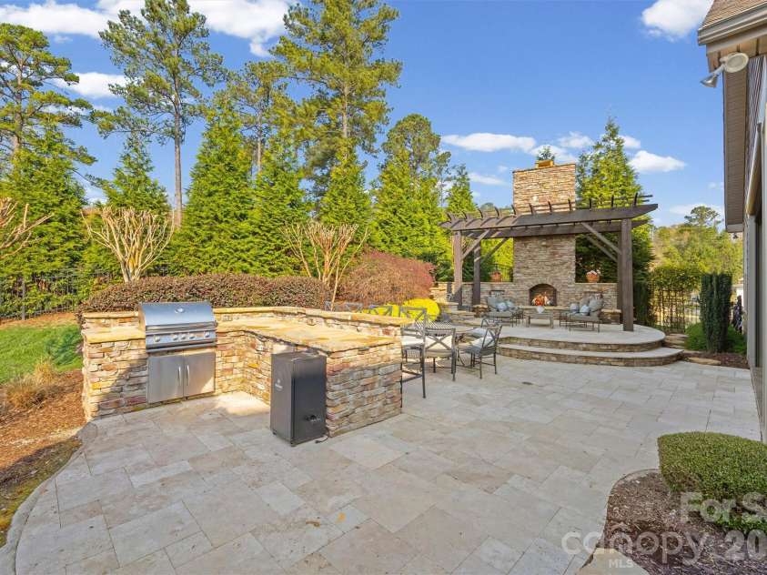 1045 Chippenham Avenue, Lancaster, SC 29720.  MLS# CAR4361759, YatesRealty ID 8794. Outdoor Kitchen and fireplace
