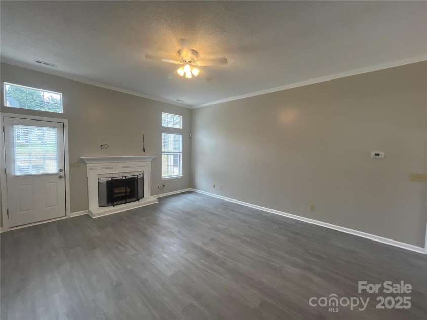 12042 Mallard Ridge Drive, Charlotte, NC 28269.  MLS# CAR4298005, YatesRealty ID 88. Living Room - alternate angle