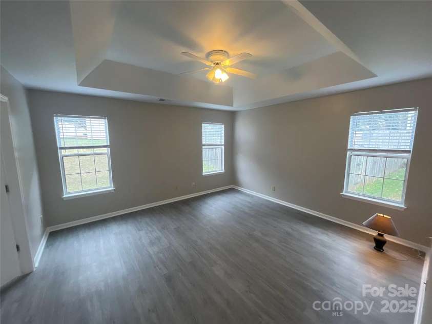 12042 Mallard Ridge Drive, Charlotte, NC 28269.  MLS# CAR4298005, YatesRealty ID 88. Primary Bedroom w/ Elegant Tray Ceiling