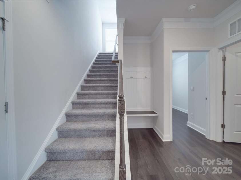 4027 Gozzi Drive, Iron Station, NC 28080.  MLS# CAR4251006, YatesRealty ID 8802. Stairs to  loft