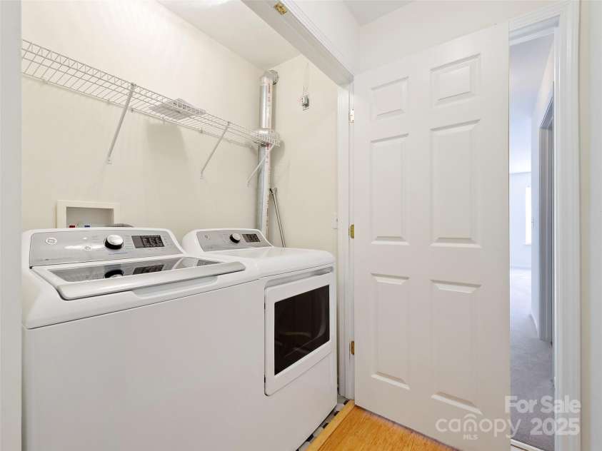406 Carrington Place, Arden, NC 28704.  MLS# CAR4248260, YatesRealty ID 8804. Washer Dryer Closet in hall between bedrooms