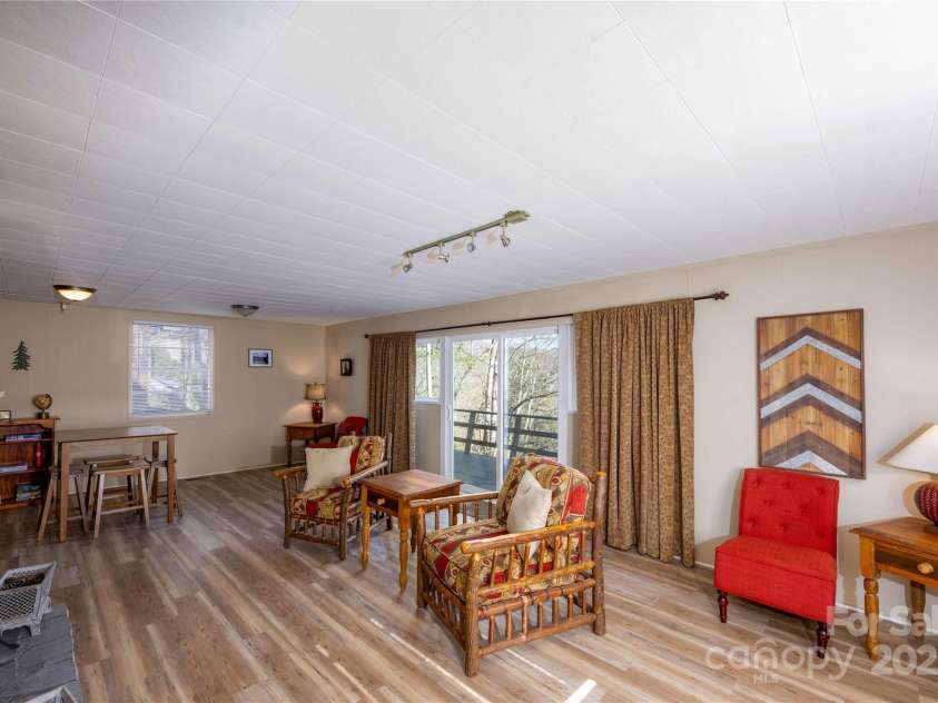 561 Deals Gap Road, Robbinsville, NC 28771.  MLS# CAR4144859, YatesRealty ID 8805. Great Room Downstairs