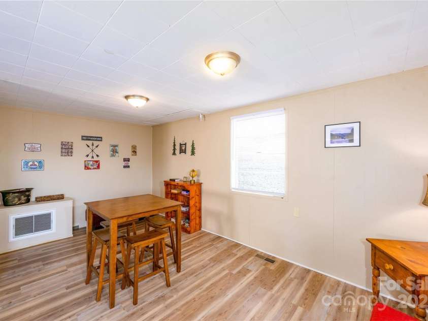 561 Deals Gap Road, Robbinsville, NC 28771.  MLS# CAR4144859, YatesRealty ID 8805. Great Room Downstairs