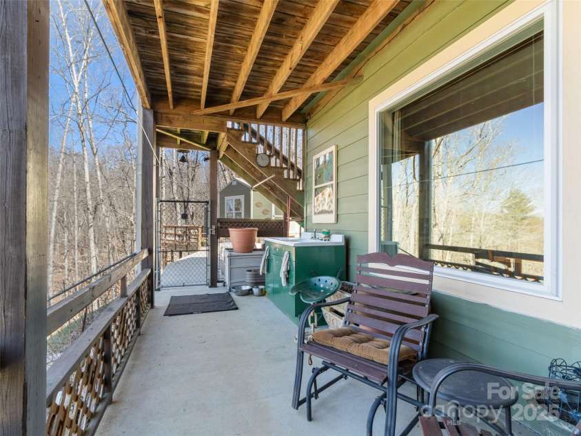 36 Crest Line Drive, Green Mountain, NC 28740.  MLS# CAR4237025, YatesRealty ID 8809. Ground patio area