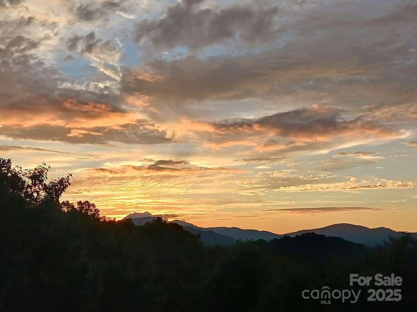36 Crest Line Drive, Green Mountain, NC 28740.  MLS# CAR4237025, YatesRealty ID 8809. Kodiak moment - sunsets you won't want to miss