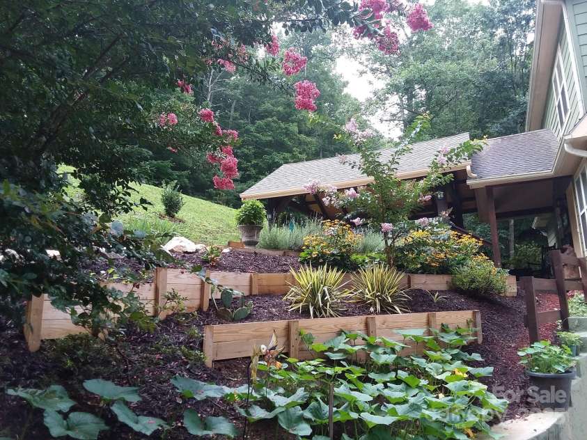 36 Crest Line Drive, Green Mountain, NC 28740.  MLS# CAR4237025, YatesRealty ID 8809. Landscaping once springs comes