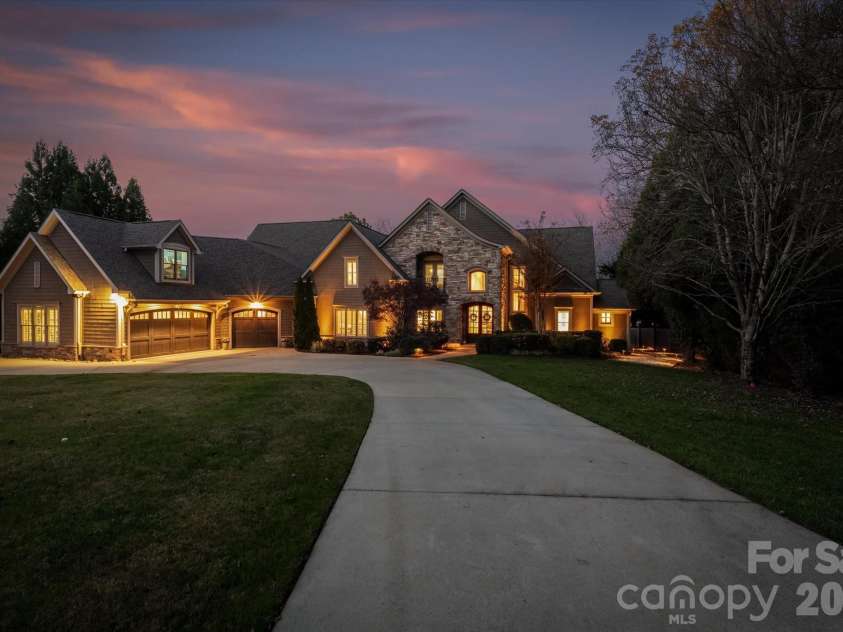 16407 Jetton Road, Cornelius, NC 28031.  MLS# CAR4326392, YatesRealty ID 881. Gated front driveway at Twilight