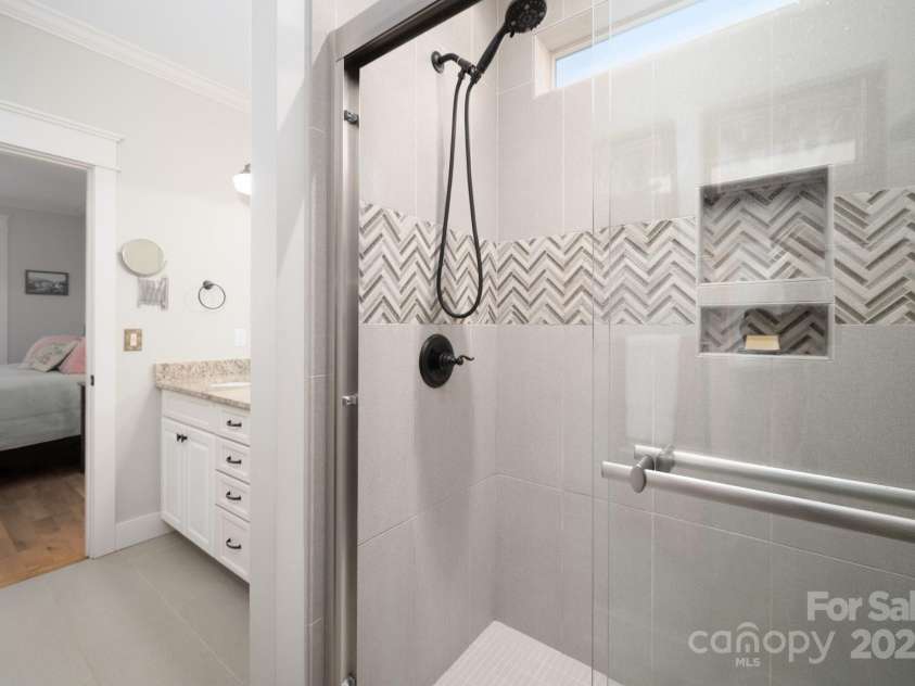 66 Deaver Street, Asheville, NC 28806.  MLS# CAR4217657, YatesRealty ID 8810. Large Walk-in Shower has Custom Tile Work