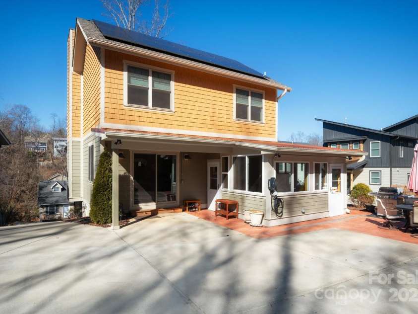 66 Deaver Street, Asheville, NC 28806.  MLS# CAR4217657, YatesRealty ID 8810. Rear Area for Parking and Easy Entry to Kitchen...Plus There's an EV Charger!