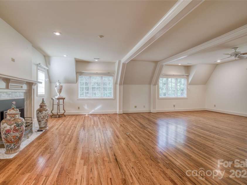 101 Woodland Drive, Morganton, NC 28655.  MLS# CAR4183990, YatesRealty ID 8812. Spacious, light filled primary bedroom with gas log fireplace