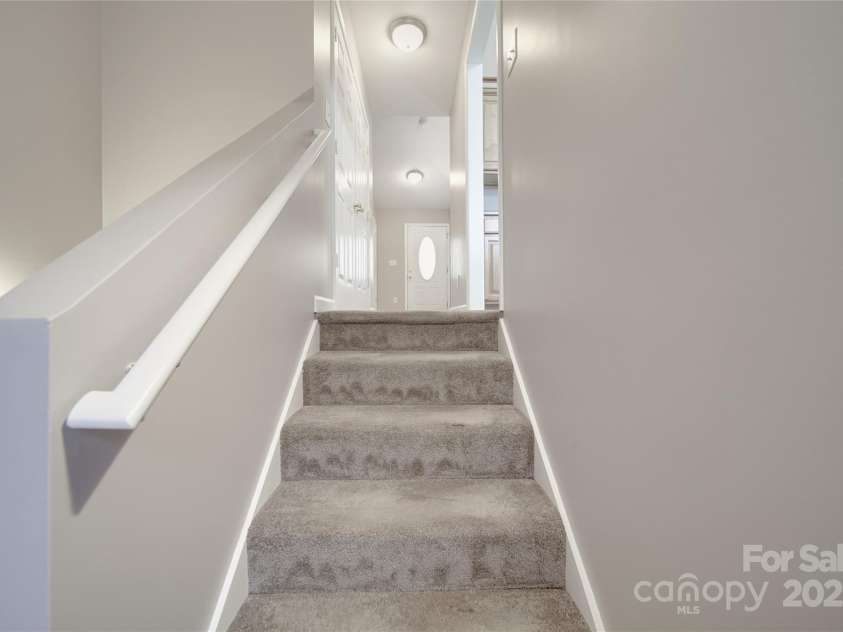 115 Scotch Irish Lane, Troutman, NC 28166.  MLS# CAR4223463, YatesRealty ID 8819. Carpeted stairs to basement