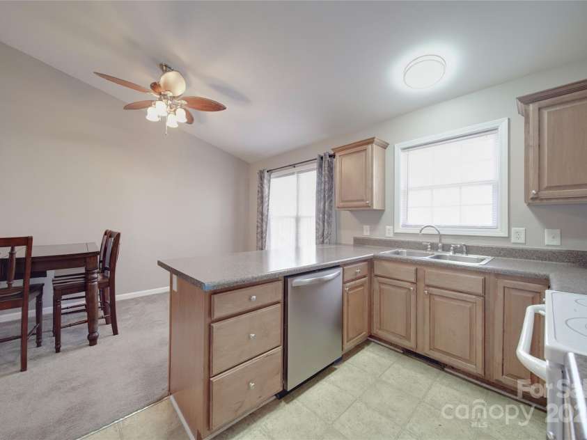 115 Scotch Irish Lane, Troutman, NC 28166.  MLS# CAR4223463, YatesRealty ID 8819. Dining area next to kitchen & double door pantry in hall behind photo
