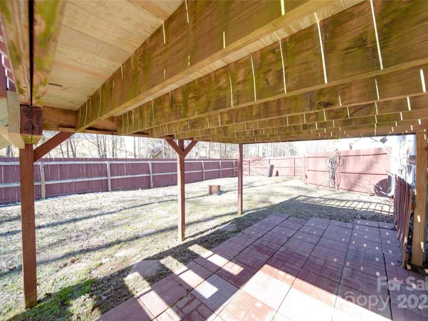 115 Scotch Irish Lane, Troutman, NC 28166.  MLS# CAR4223463, YatesRealty ID 8819. Walkout to back yard under rebuilt deck