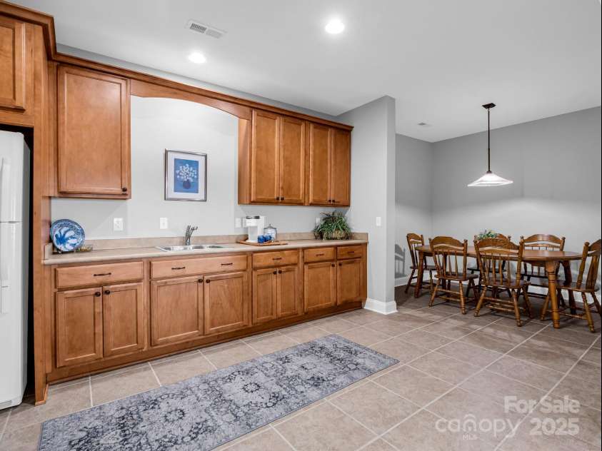 143 Lindsley Court, Hendersonville, NC 28792.  MLS# CAR4211464, YatesRealty ID 8821. Basement dining/kitchen