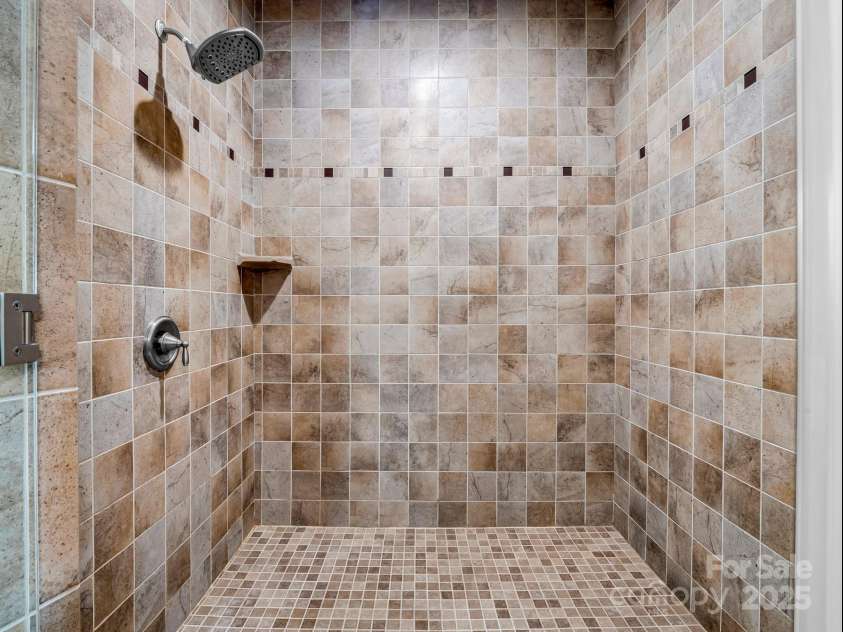 143 Lindsley Court, Hendersonville, NC 28792.  MLS# CAR4211464, YatesRealty ID 8821. Primary step-in shower.