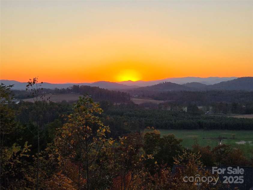 143 Lindsley Court, Hendersonville, NC 28792.  MLS# CAR4211464, YatesRealty ID 8821. Sunset view from main deck.