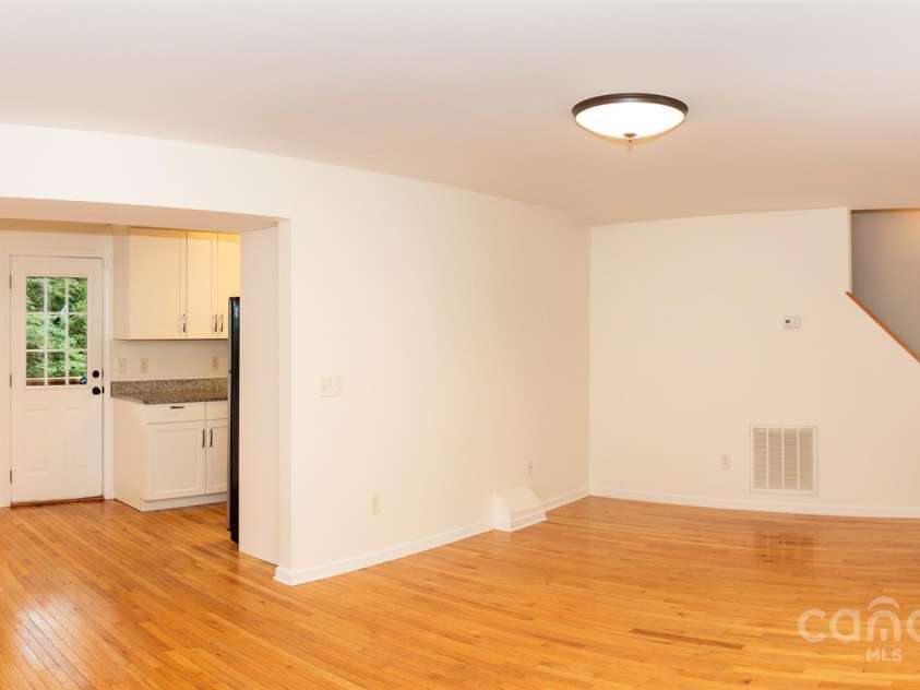 13 Castle Street, Asheville, NC 28803.  MLS# CAR4278006, YatesRealty ID 883. Panorama of Front Door, Stairs to Upstairs, Living Room, Dining Area, and Kitchen