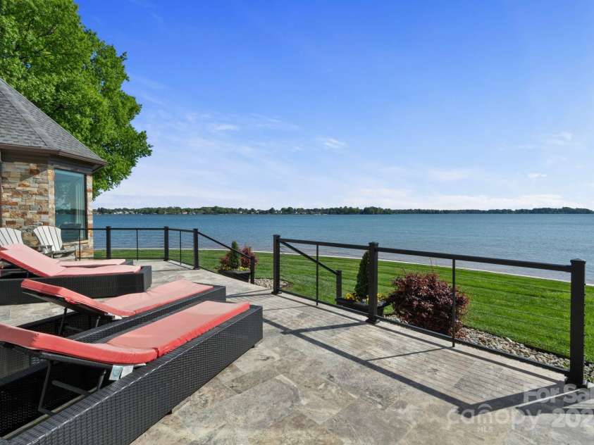 114 Ventana Court, Mooresville, NC 28117.  MLS# CAR4241186, YatesRealty ID 8842. Luxurious waterfront living on Lake Norman.  Refreshed seawall with approx. 170' of shoreline