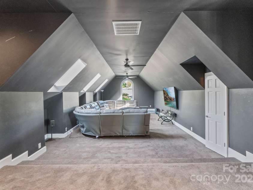 114 Ventana Court, Mooresville, NC 28117.  MLS# CAR4241186, YatesRealty ID 8842. Media room with half bath and snack bar