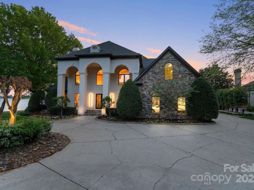 114 Ventana Court, Mooresville, NC 28117.  MLS# CAR4241186, YatesRealty ID 8842. Premier Lake Norman Waterfront estate in the gated community of Alexander Island in Langtree