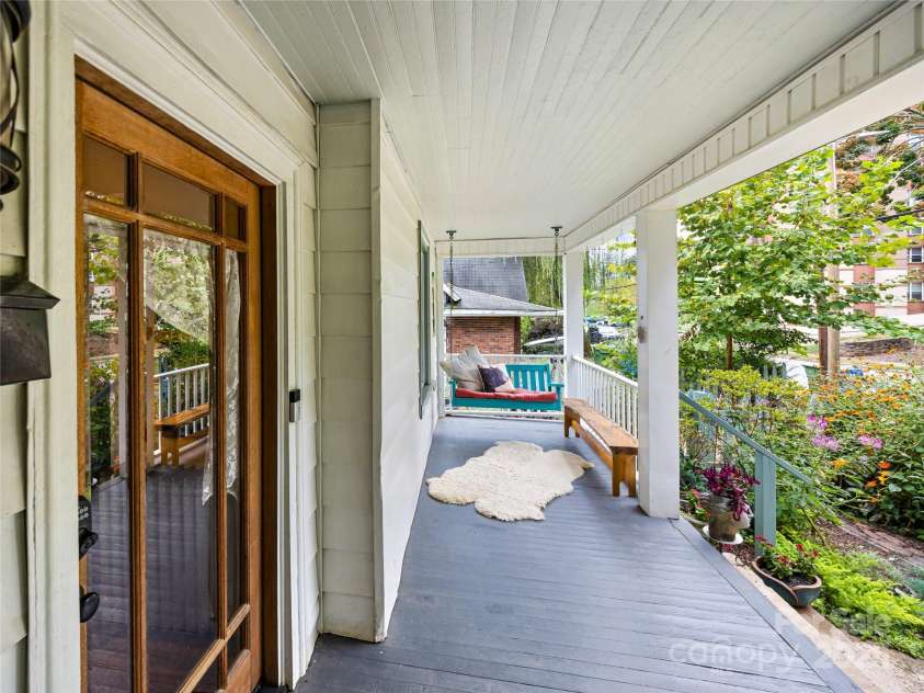 138 French Broad Avenue, Asheville, NC 28801.  MLS# CAR4301394, YatesRealty ID 8844. Sipping porch