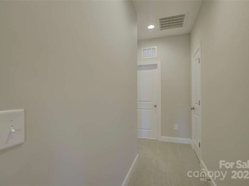 17809 Pawleys Plantation Lane, Charlotte, NC 28278.  MLS# CAR4230692, YatesRealty ID 8846. Hallway to laundry room and bedroom 2 (en-suite)