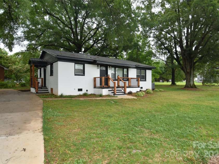 706 Mcintyre Street, Monroe, NC 28110.  MLS# CAR4268048, YatesRealty ID 8848. Featuring Three Huge Oak Trees that include a nice brick ranch.