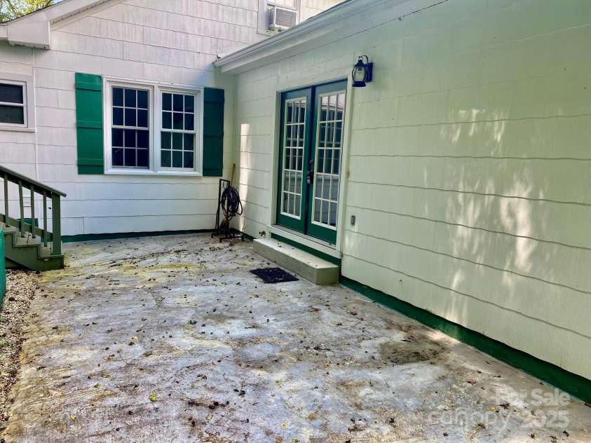 1294 Cane Creek Road, Bakersville, NC 28705.  MLS# CAR4291675, YatesRealty ID 885. Back patio with new patio doors offers great place for outdoor activities.