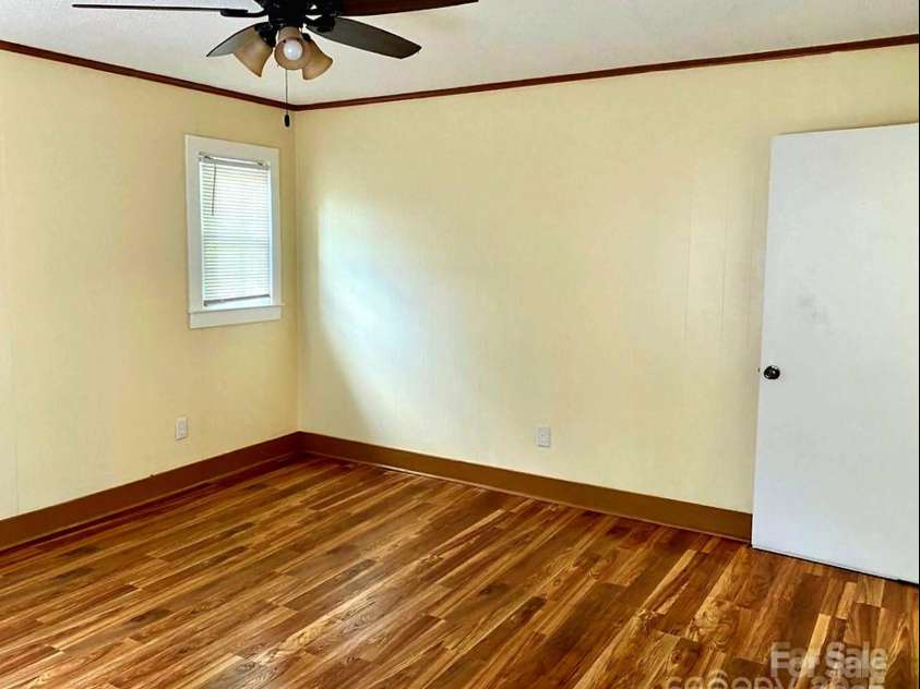 1294 Cane Creek Road, Bakersville, NC 28705.  MLS# CAR4291675, YatesRealty ID 885. Generous bedrooms with beautiful floors.