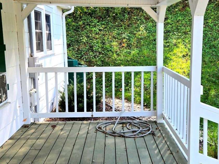 1294 Cane Creek Road, Bakersville, NC 28705.  MLS# CAR4291675, YatesRealty ID 885. Lovely covered porch.