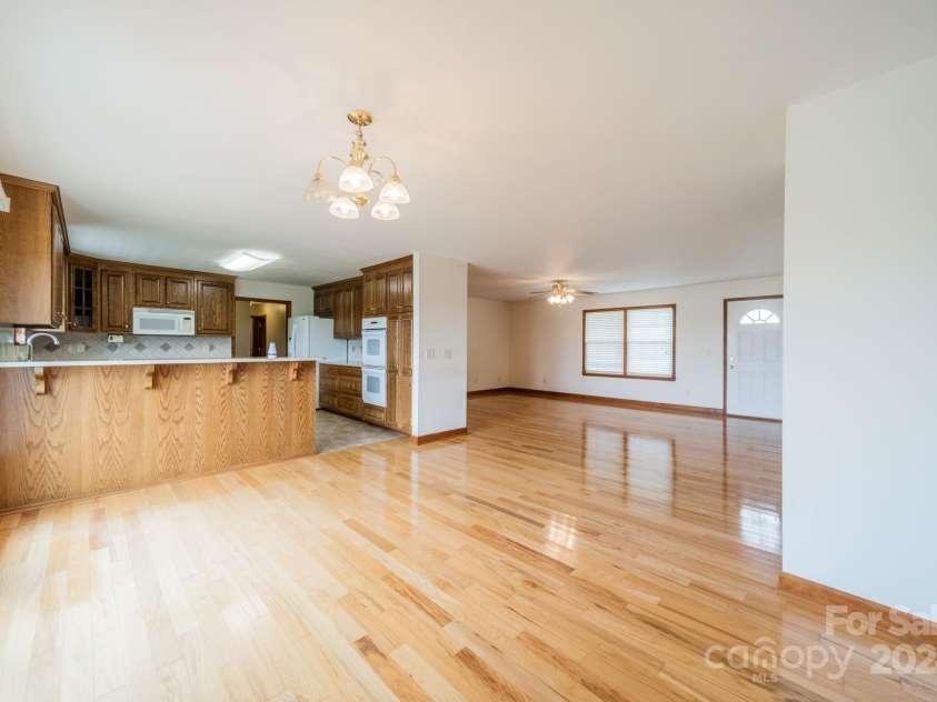 24686 Barbees Grove Road, Oakboro, NC 28129.  MLS# CAR4134946, YatesRealty ID 8851. Large dining area with a nice breakfast bar.