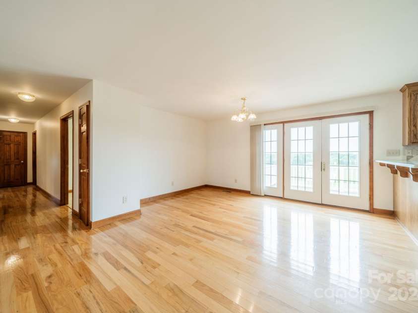 24686 Barbees Grove Road, Oakboro, NC 28129.  MLS# CAR4134946, YatesRealty ID 8851. The door at the end of the hall opens to a linen closet.