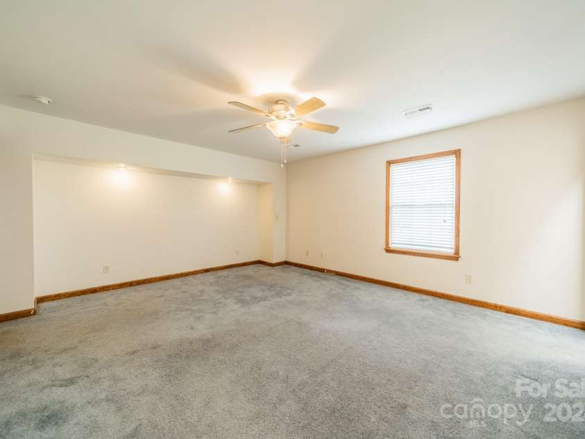 24686 Barbees Grove Road, Oakboro, NC 28129.  MLS# CAR4134946, YatesRealty ID 8851. This recessed space in the primary bedroom is perfect for a king-sized bed and two matching nightstands.