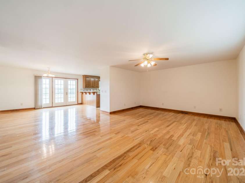 24686 Barbees Grove Road, Oakboro, NC 28129.  MLS# CAR4134946, YatesRealty ID 8851. View from the living room into the dinning area and kitchen.