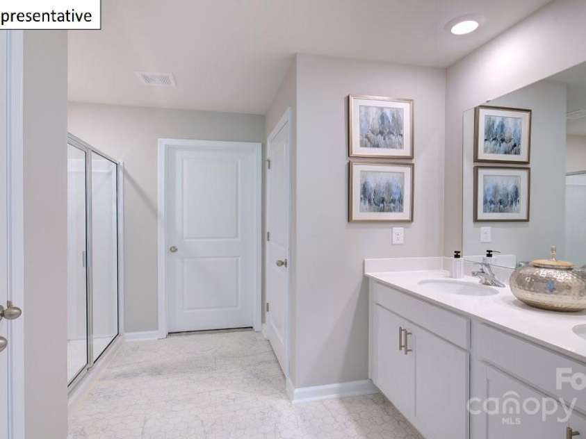 3527 Cramer Creek Drive, Gastonia, NC 28056.  MLS# CAR4221301, YatesRealty ID 886. Primary bathroom with dual sinks and 5ft shower