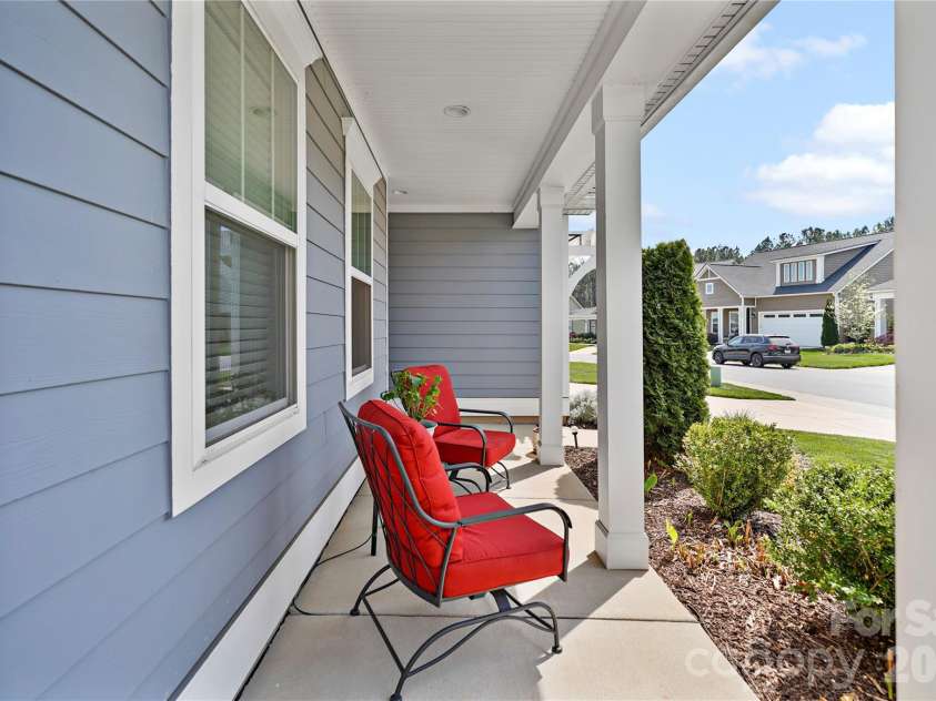 445 Bowline Drive, Denver, NC 28037.  MLS# CAR4363153, YatesRealty ID 8867. Rocking chair front porch