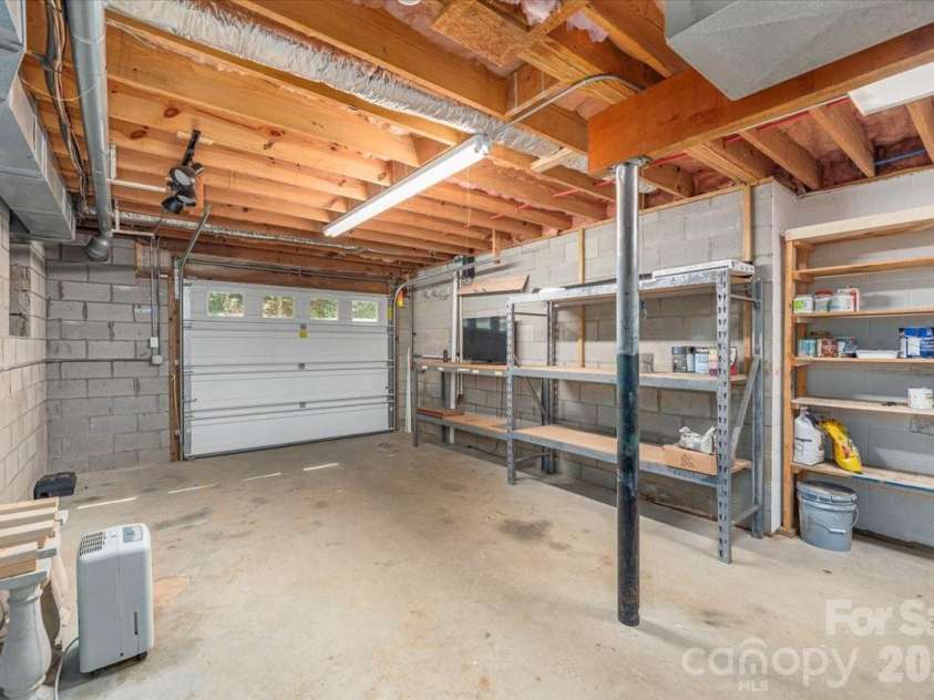 295 Laurel Ridge Drive, Waynesville, NC 28786.  MLS# CAR4312458, YatesRealty ID 8868. Third Golf Cart/Motorcycle Garage & Workroom