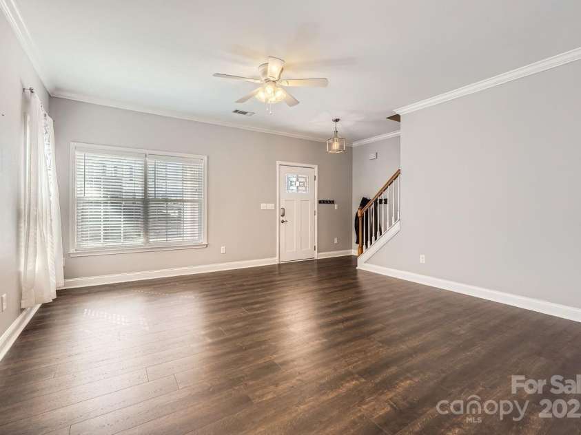141 Silverspring Place, Mooresville, NC 28117.  MLS# CAR4218653, YatesRealty ID 8869. Look how large and bright your Living Room combo Dining Room are!