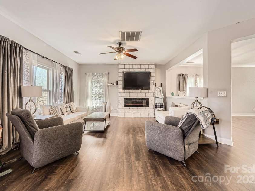 141 Silverspring Place, Mooresville, NC 28117.  MLS# CAR4218653, YatesRealty ID 8869. Looking into your Family Room with electric Fireplace. Change it's colors for your mood or holiday pleasure!